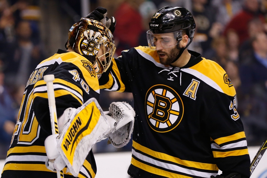 Mar 31, 2015; Boston, MA, USA; Boston Bruins center Patrice Bergeron (37) congratulates goalie Tuukka Rask (40) after defeating the Florida Panthers 3-2 at TD Banknorth Garden. Mandatory Credit: Greg M. Cooper-USA TODAY Sports